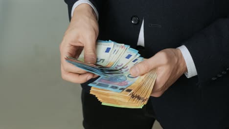 men's hands quickly count banknotes. businessman counts euro in hands. eur