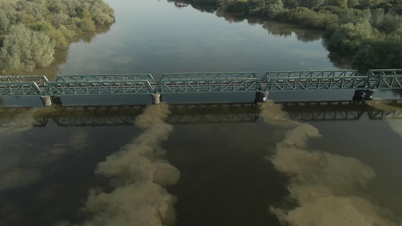 Train bridge crossing the Shannon River on the outskirts of Limerick, Ireland, aerial view