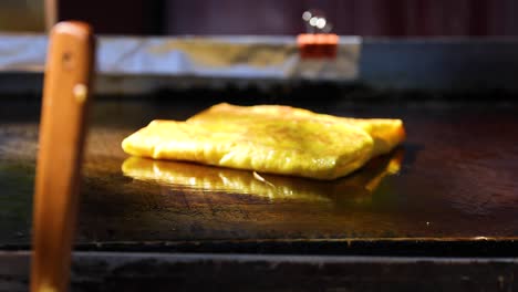 roti being cooked on a hot griddle