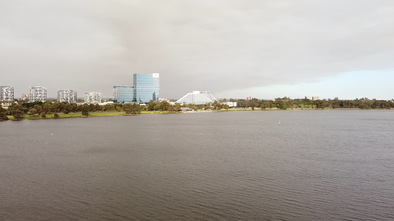 Aerial flyover the Swan River Perth towards the Crown Casino and hotels