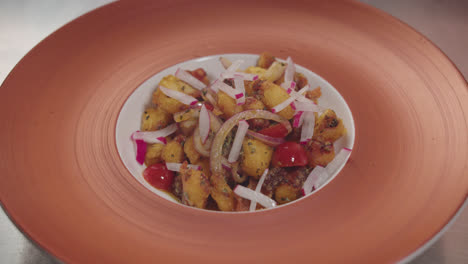 crispy gnocchi salad with radishes, red onion, and bacon