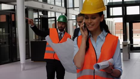 female architect talking on mobile phone