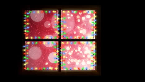 animation of window with fairy lights over snow and light spots at christmas