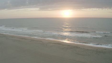 Aerial-view-of-gentle-waves-rolling-in-from-the-surf