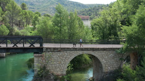 young woman on morning walk with her pet dog lago de bolarque