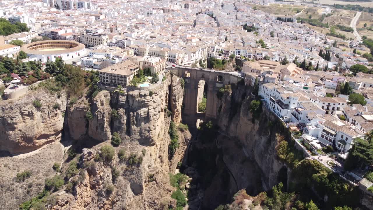 Aerial view captures Ronda's iconic bridge in Spain, gracefully connecting the charming village with architectural splendor