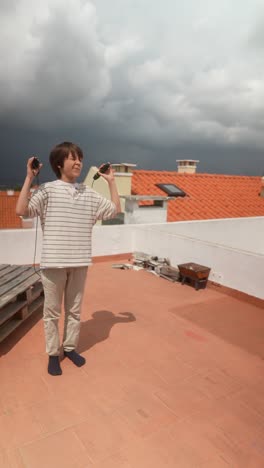 Boy Jumping Rope on a Rooftop