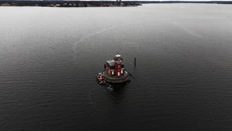 an aerial view of the stepping stones lighthouse, built in a victorian-style located in the long island sound, ny