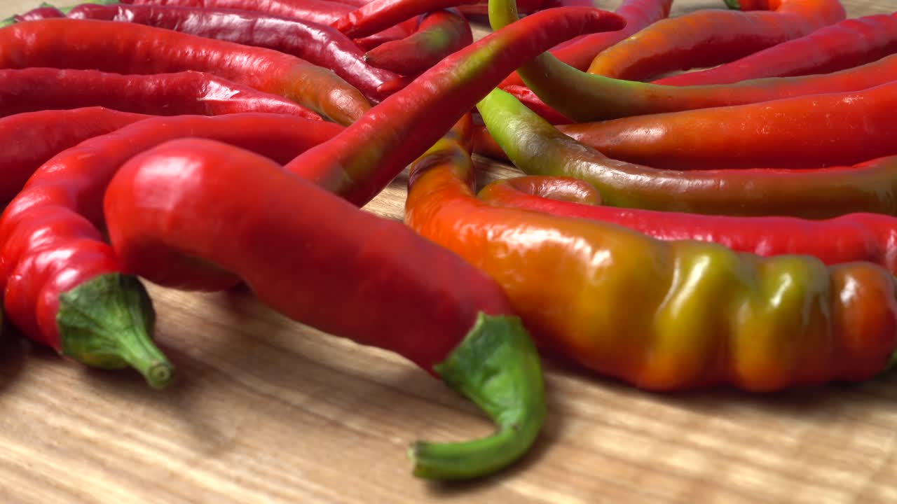 Red chilli, pepper. Shooting in the movement. Shooting in kitchen