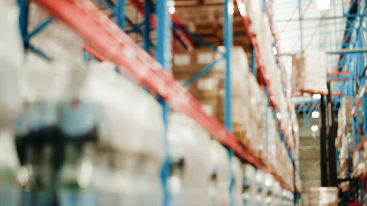Forklift Moving Boxes on Shelves in a Large Warehouse