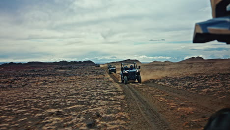 column of atv vehicles exploring the wild volcanic landscapes of iceland