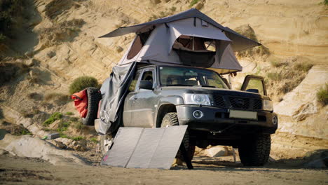 a tent on top of a 4x4 on a beach in albania