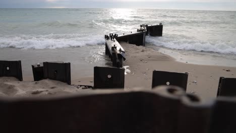 waves crashing on breakers in lake, michigan located in frankfort, michigan with stable close up video