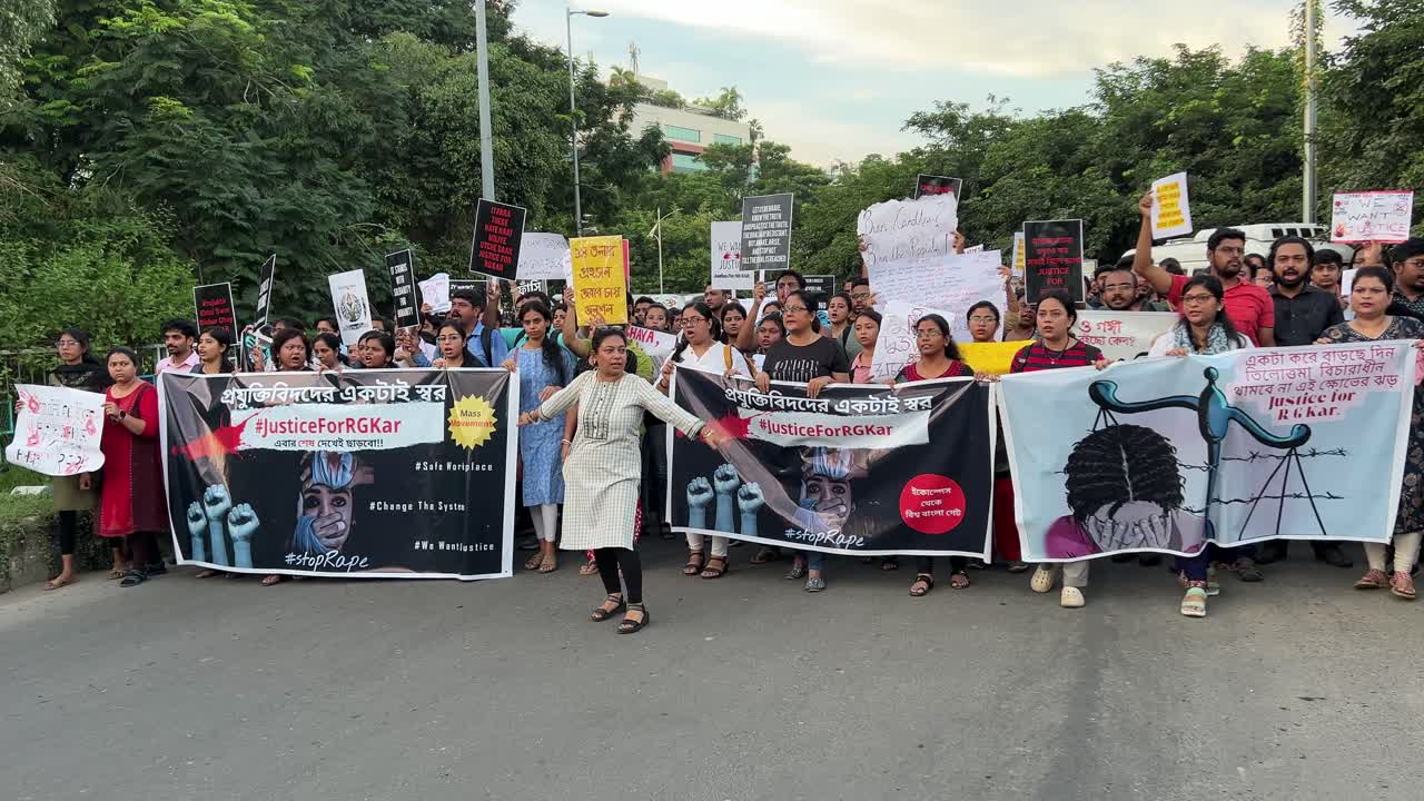Women and men protesting against rape case of a doctor at RG Kar hospital during her duty time in Kolkata, India.