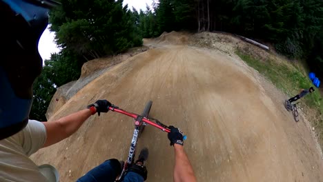 first-person view of mountain biking on dirt jumps and trails