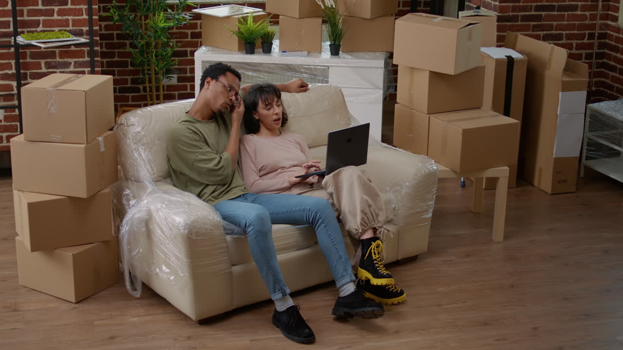 Diverse couple finding decor inspiration and buying furniture online