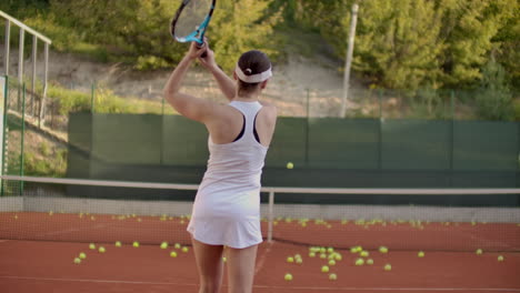 a tennis player prepares to serve a tennis ball during a match. slow motion