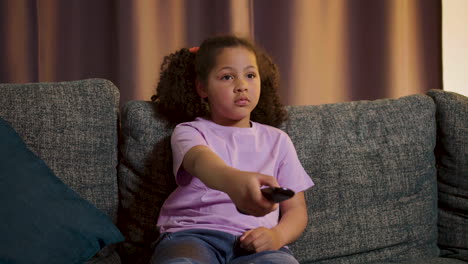 kid watching film at home