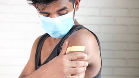 man receiving a vaccine shot