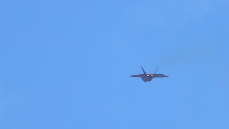 f-22 raptor performs aerial maneuvers against a clear blue sky at avalon airshow in geelong, showcasing speed and agility