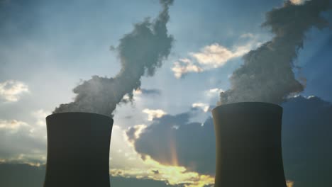 steaming cooling towers of nuclear power plant