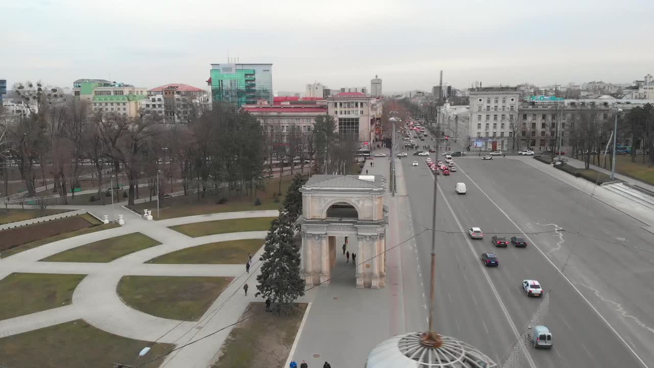 Cityscape with Arch, Buildings, and People