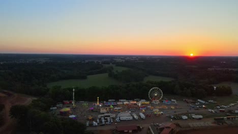 aerial view of s small town carnival during a beautiful sunset