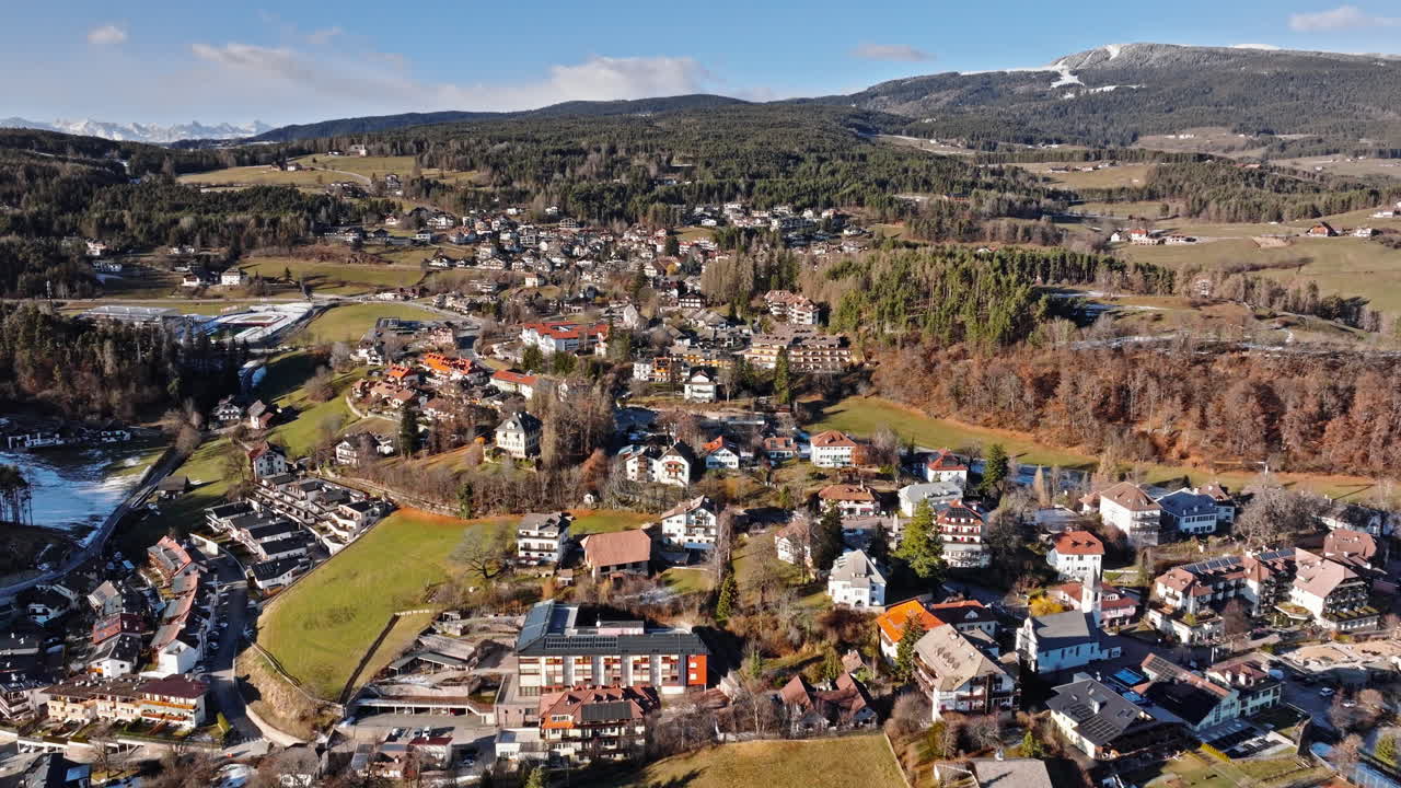 Aerial drone view of the Soprabolzano village on the Renon plateau in the Dolomites, Italy