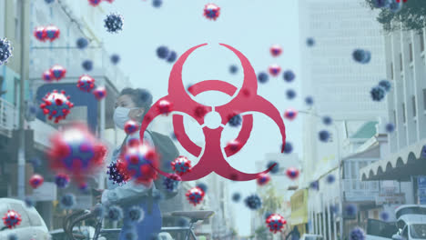 animación de células del virus covid-19 y icono de peligro biológico sobre una mujer con máscara facial montando una bicicleta de ruedas