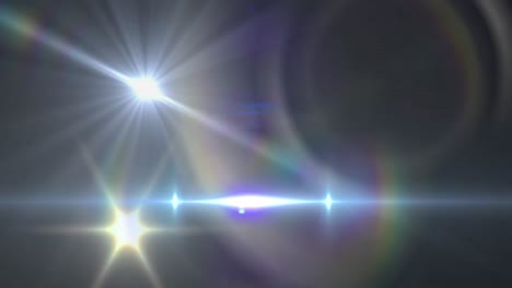Animation-of-spotlights-with-lens-flare-and-light-beams-moving-over-dark-background
