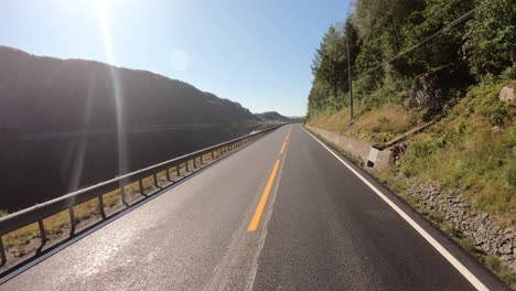 vehicle point-of-view driving a car on a road in norway