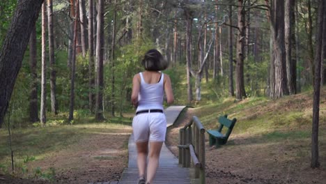 girl running away in the forest