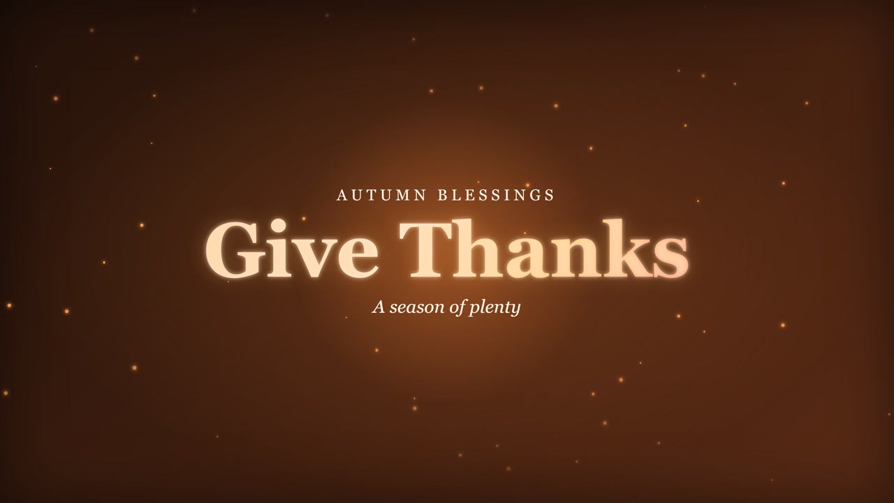 Cartello titolo caldo del Ringraziamento con la scritta "Give Thanks" e particelle luminose su uno sfondo marrone rustico