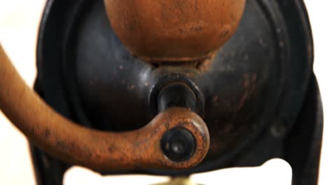 vintage coffee grinder with coffee beans