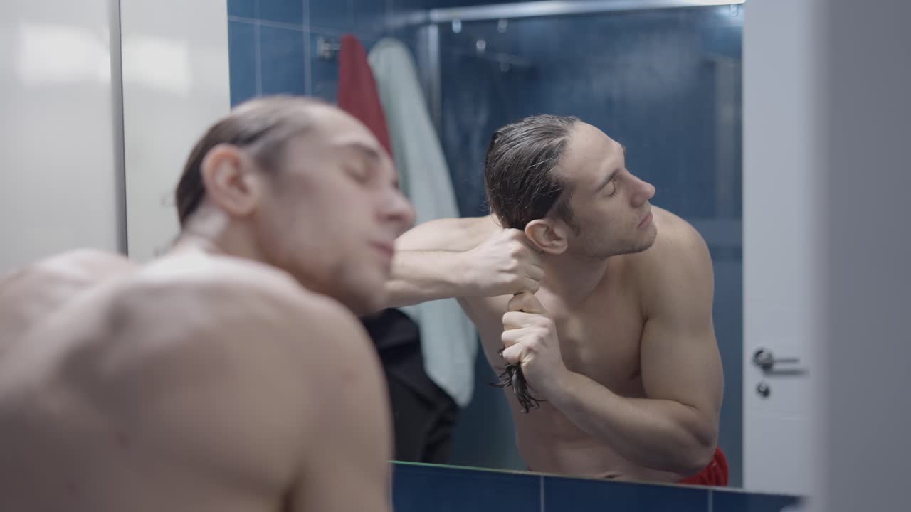 Man washing hair in the bathroom