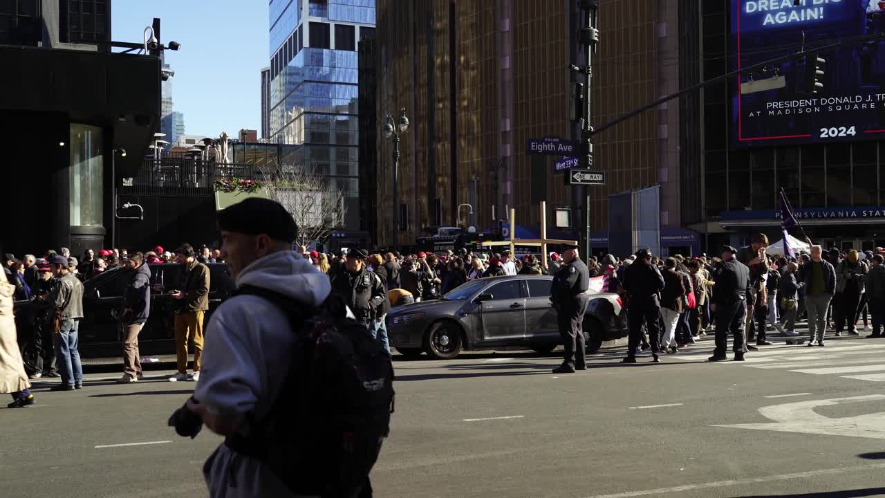 In the sunlight, crowds of Trump’s supporters surround Madison Square Garden, their cheers resonating throughout the city
