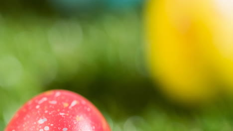 animation of colourful easter eggs on grass