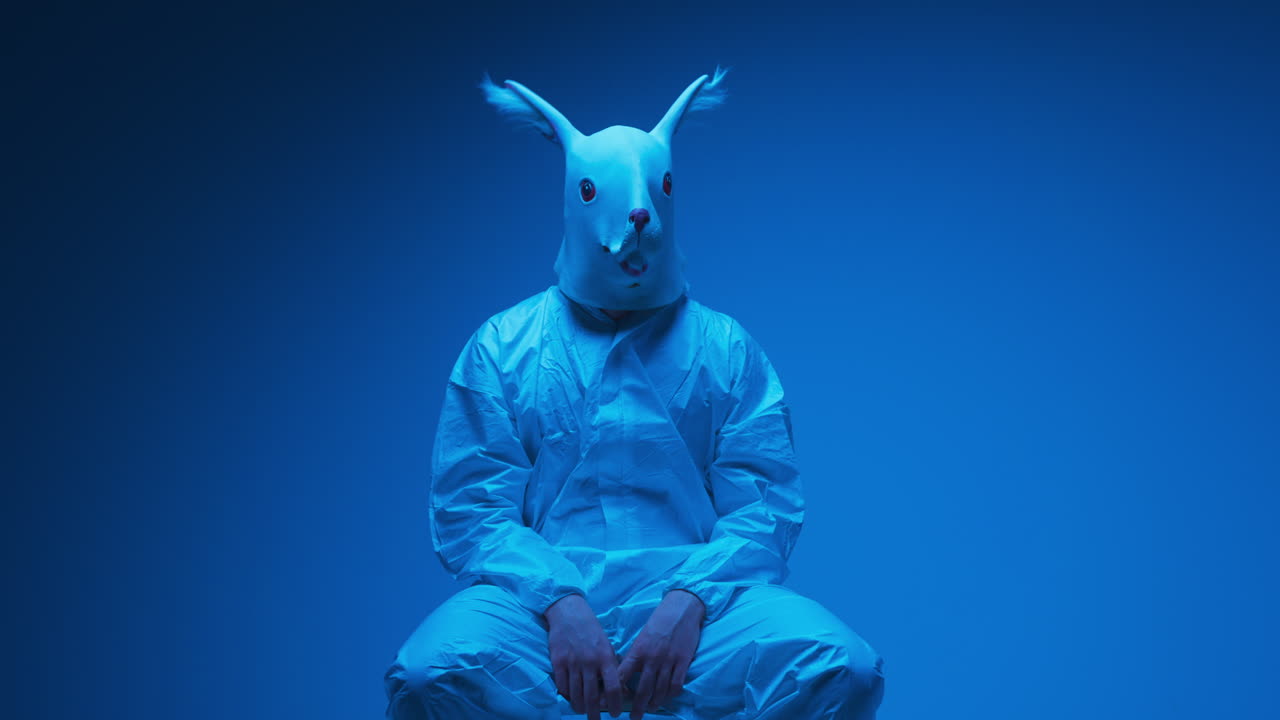 Person in Rabbit Mask and Hazmat Suit