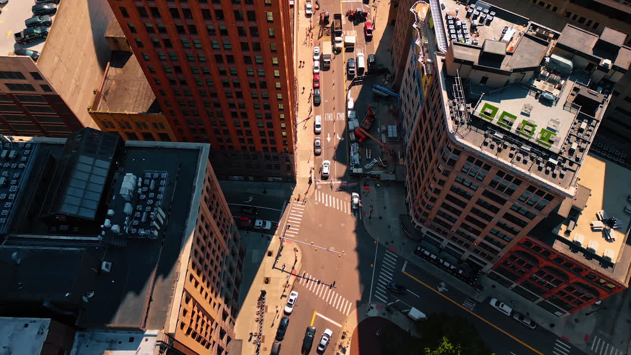 Crossroads in the cityscape of Detroit, Michigan, USA. Footage over the tops of high-rises at daytime
