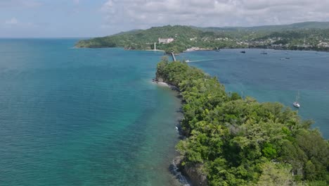 aerial pullback of narrow island vigia in samana bay, dominican republic