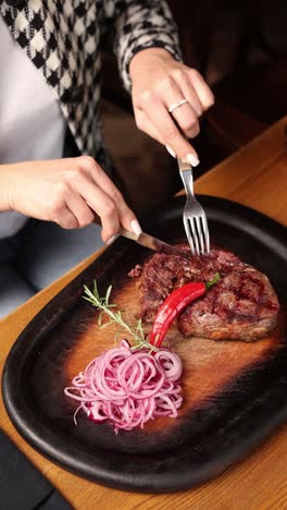 woman eating steak dinner