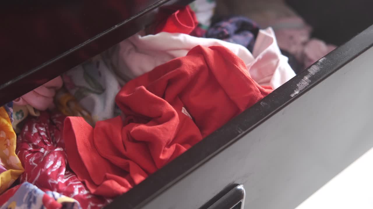 Messy Drawer with Clothes
