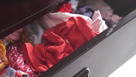 messy drawer with clothes