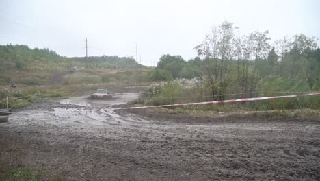 off-road vehicle race in muddy terrain