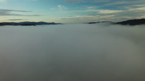 4k resolution drone flight above the clouds among mountain tops of costa rica