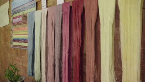 colorful hand-dyed yarns hanging to dry