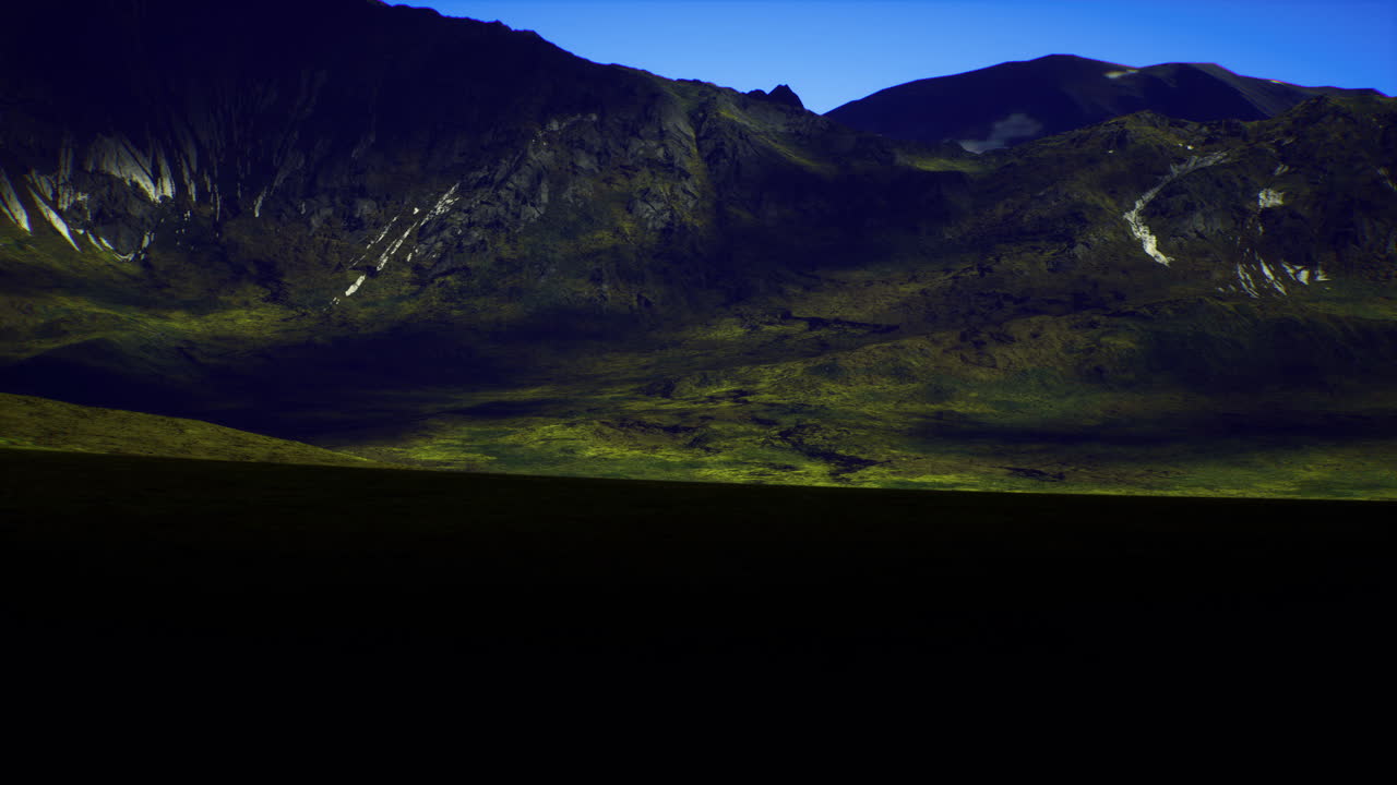 Highland landscape during twilight with dramatic mountains and shadows