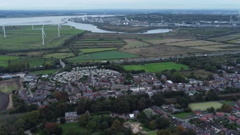Aerial-view-above-Halton-North-England-Runcorn-Cheshire-countryside-wind-turbines-industry-landscape-slow-reverse
