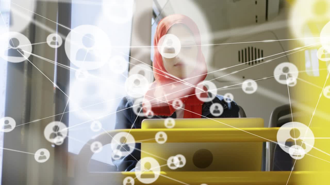 Woman working on laptop in city bus, pole moving away as network icons expanding for networking