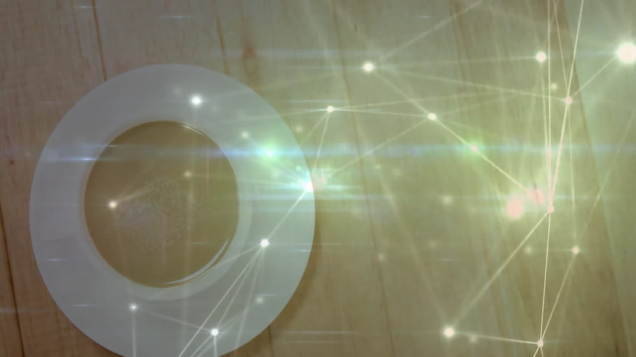 Digital network covering coffee cup on wood tabletop, showing glowing nodes and bright lens flares